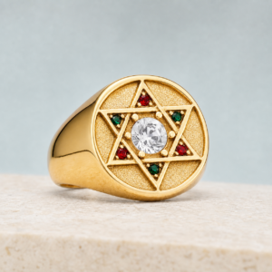 Bague Magen David dorée sertie de pierres rouges et vertes