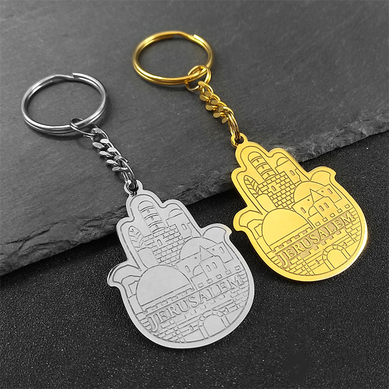 Porte-clés argenté avec main Hamsa et paysage de Jérusalem